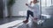 Tired caucasian female doctor sitting on stairs in hospital corridor