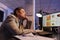 Tired corporate worker sleeping at desk table in startup office