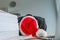 Tired and exhausted businessman with Santa Claus hat fell asleep over his desk during Christmas