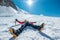 Tired exhausted climber lying under Mont Blanc du Tacul mountain. Wide opened legs in boots with crampons and mountaineering