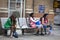 Tired Girls who collected money for charity, is sitting on a bench near the train station Liverpool station