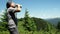 Tired hiker drinking water from a water bottle.