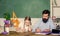 Tired kid unmotivated study learn. Private lesson. Homeschooling with father. School teacher and schoolgirl. Man bearded