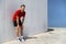 Tired male athlete runner exhausted of cardio workout breathing hard after difficult exercise. Fitness man running sweating of