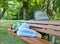 Tired mother asleep on a bench in a park