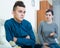 Tired mother rebuking teenage son at home