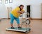 Tired overweight woman on trainer treadmill