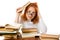 Tired red-haired girl in glasses with books