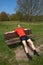 Tired Runner Resting on Sunny Park Bench