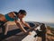 Tired runner taking a break leaning guardrail