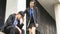 Tired and sadness Businessman sitting on the floor pedestrian space with the businesswoman friend cheers up. He feel sad worry