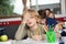 Tired Schoolboy Sitting At Desk In Classroom