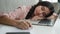 Tired sleeping woman sleep closed eyes on office table sleepy overworked female student girl exhausted weary lazy Indian