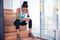 Tired sports woman sitting on the stairs