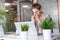 Tired, stressed businesswoman at laptop in office