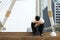 Tired or stressful businessman sitting sadly on stairs after working