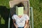 Tired teenager student asleep on sunbed with book