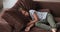 Tired tranquil little cute kid girl sleeping on comfortable sofa.