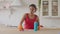 Tired woman polishing table with cleaning detergent