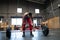 Tired woman weightlifting alone in a gym