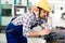 Tired worker fall asleep during working hours in factory