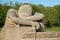 Tired worker in Pink Granite rock in statue parc in Brittany