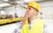 Tired workman yawning sleepy on workplace inside factory