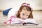 Tired young schoolgirl with books