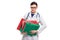 Tired young woman doctor with stethoscope holding binders in her hands in white uniform on white background