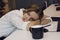 Tired young woman laid her head down on the Desk in the office