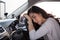 Tired young woman sleep in car, Hard work causes poor health, Sit asleep while the car is on a red light,