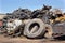 Tires and metal scraps on pile