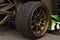 Tires of race car for driving. Drag and drift car with lower-profile tire. Racing low profile tyre with brake disc. Alloy wheel