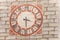 TISO, ITALY - SEPTEMBER 12, 2017: The clock painted and recently restored outside the bell tower of the church