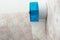 Tissue paper in blue box hang on wall toilet inside home - Image