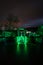 Titan RT suspension rope bridge illuminated in green at night over the Rappbodetal