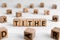 Tithe - words from wooden blocks with letters