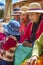 TITICACA, PERU - DEC 29: Indian women peddling her wares on a re