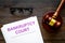 Title of documents the bankruptcy court near judge gavel on dark wooden background top view