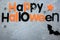 Title Happy Halloween on the gray background. Decoration, flat lay,