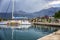 Tivat, Montenegro 07/07/2016: pleasure sailing catamaran on the pier against the backdrop of the mountains. Beautiful landscape