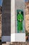 TIWI, OMAN - MARCH 4, 2017: Portrait of Sultan Qaboos on a pillar of a highway bridge over Wadi Tiwi, Om