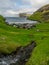 Tjornuvik village and beach with The Giant and the Witch sea stacks rock