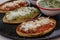 Tlacoyos Mexican food, green and red sauce in Mexico city spicy food mexican culture