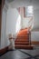 Tlatelolco, CDMX, 10 12 22, Antique stair lift with folding seat, luxurious circular wooden staircase