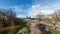 Tme lapse of foot traffic freeway traffic and white clouds over downtown city of Portland Oregon