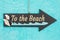 To the beach hanging arrow chalkboard sign with seashells