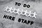 To Do Hire Staff text with paper people chain and question marks on vacant positions to fill, staff shortages and workforce