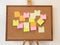 A To Do List with post it paper on cork notice board