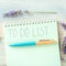 To do list square shot with lavender and a turquoise blue pen